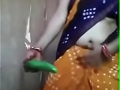 Desi aunty playing with cucumber